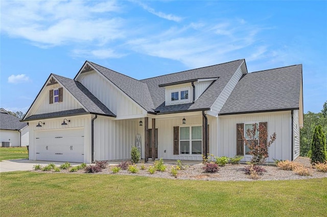 461 Barnwood Dr, Rockmart, GA 30153 - modern farmhouse featuring an attached garage, a front lawn, driveway, and a shingled roof
