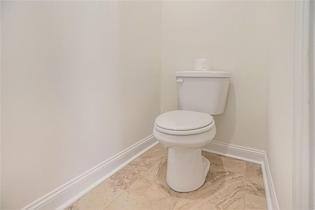 461 Barnwood Dr, Rockmart, GA 30153 - bathroom with baseboards, toilet, and marble finish flooring
