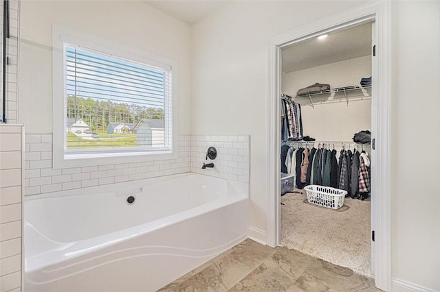 461 Barnwood Dr, Rockmart, GA 30153 - full bathroom with a bath, baseboards, and a walk in closet