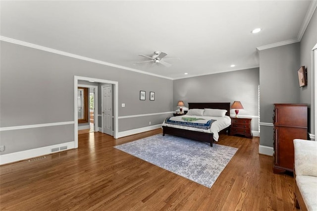 bedroom with crown molding, wood finished floors, recessed lighting, baseboards, and ceiling fan