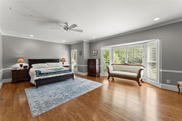 bedroom featuring baseboards, ornamental molding, recessed lighting, wood finished floors, and a ceiling fan