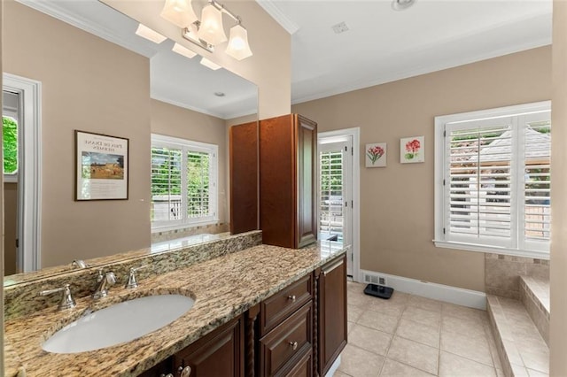 bathroom with ornamental molding, baseboards, vanity, and tile patterned flooring