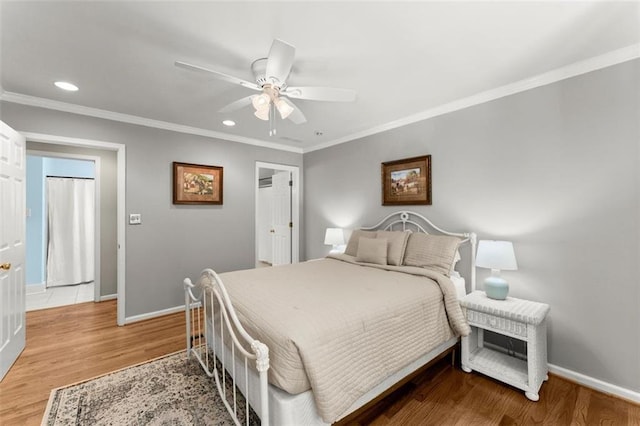 bedroom with baseboards, recessed lighting, wood finished floors, crown molding, and a ceiling fan