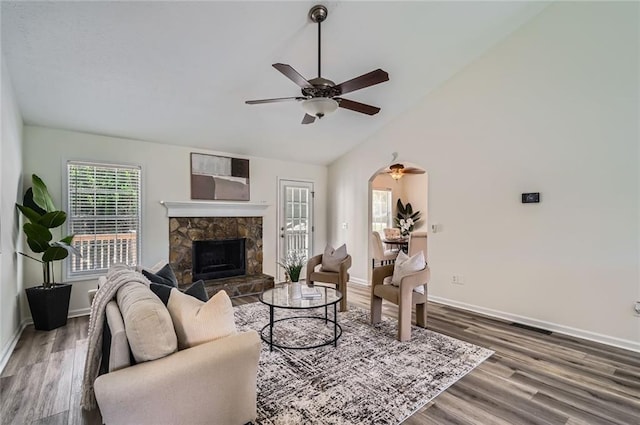 3290 Spincaster Way, Loganville, GA 30052 - living area with ceiling fan, wood finished floors, vaulted ceiling, and a fireplace