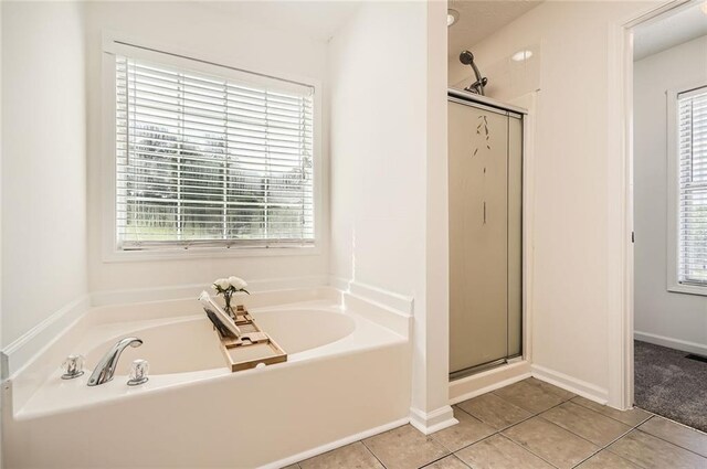 3290 Spincaster Way, Loganville, GA 30052 - bathroom with a garden tub, a shower stall, and tile patterned floors