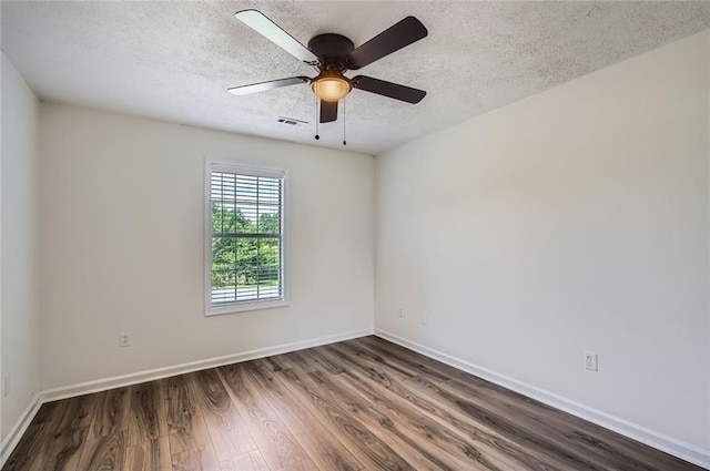 3290 Spincaster Way, Loganville, GA 30052 - empty room featuring wood finished floors, a textured ceiling, and a ceiling fan