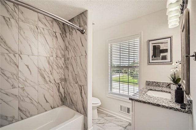 3290 Spincaster Way, Loganville, GA 30052 - bathroom featuring marble finish floors, vanity, tub / shower combination, plenty of natural light, and a textured ceiling