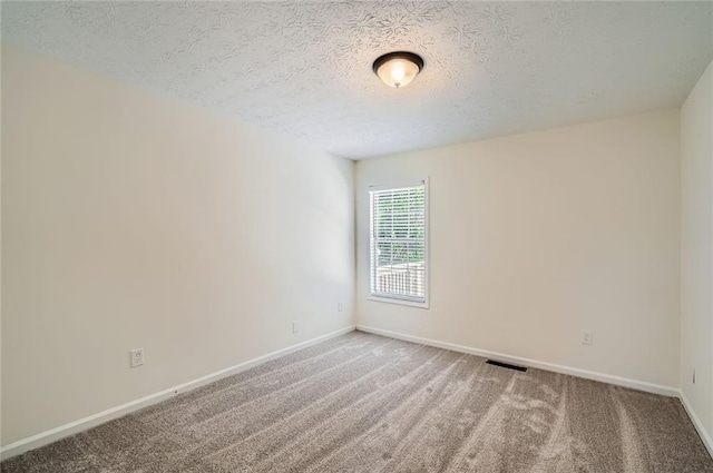 3290 Spincaster Way, Loganville, GA 30052 - spare room featuring a textured ceiling and carpet
