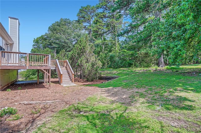 3290 Spincaster Way, Loganville, GA 30052 - view of green lawn with stairs and a wooden deck