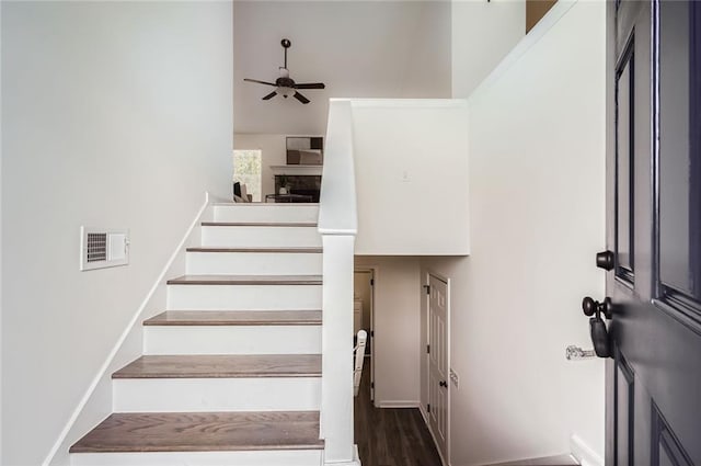 3290 Spincaster Way, Loganville, GA 30052 - stairway with a ceiling fan and wood finished floors
