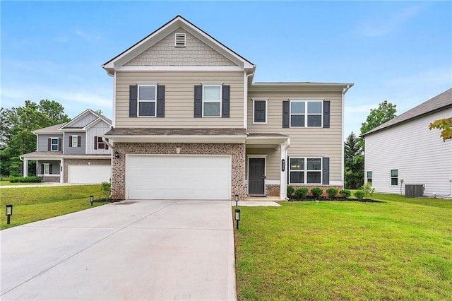 228 Whitneys Way, Dallas, GA 30157 - view of front of house with a front yard, an attached garage, brick siding, and concrete driveway