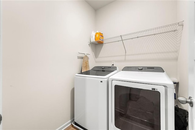 228 Whitneys Way, Dallas, GA 30157 - laundry area with separate washer and dryer and baseboards