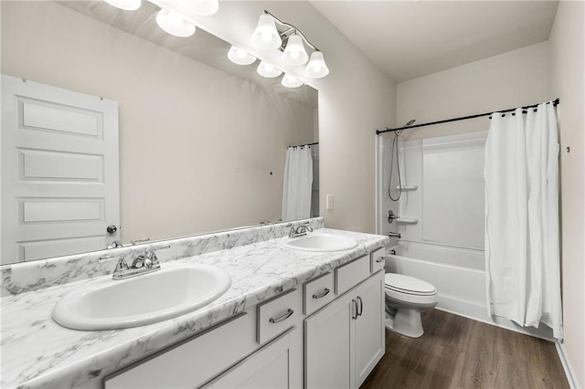 228 Whitneys Way, Dallas, GA 30157 - bathroom featuring double vanity, toilet, wood finished floors, and shower / tub combo with curtain