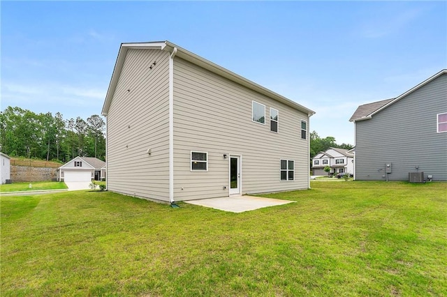 228 Whitneys Way, Dallas, GA 30157 - rear view of house with central AC, a patio, a lawn, and a garage