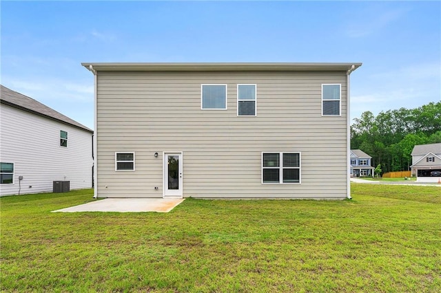 228 Whitneys Way, Dallas, GA 30157 - back of house featuring a patio, a lawn, and central AC