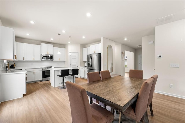228 Whitneys Way, Dallas, GA 30157 - dining space featuring light wood-style floors, recessed lighting, and baseboards