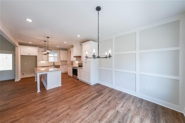 82 Lexie Ct, Rockmart, GA 30153 - kitchen featuring a chandelier, stainless steel electric range oven, recessed lighting, and white cabinets