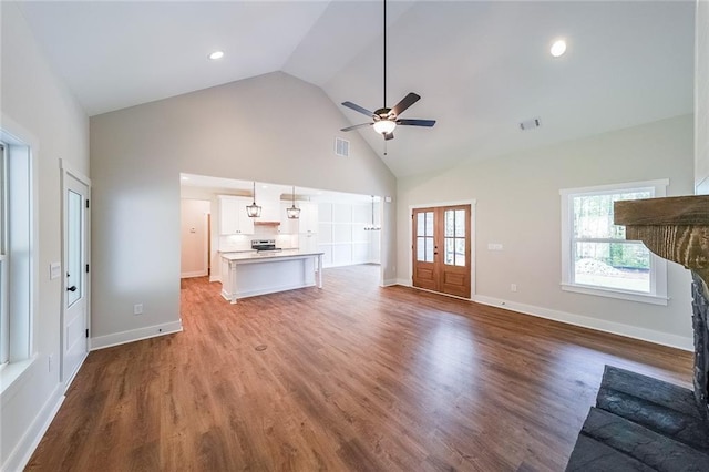 82 Lexie Ct, Rockmart, GA 30153 - unfurnished living room featuring high vaulted ceiling, ceiling fan, wood finished floors, and baseboards