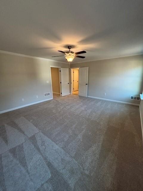 spare room with carpet, ceiling fan, and ornamental molding