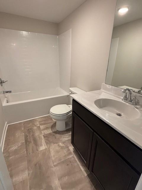 full bathroom featuring vanity, toilet, and shower / bathtub combination