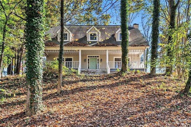 cape cod home with covered porch