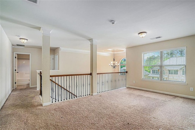 unfurnished room featuring carpet flooring, crown molding, and a chandelier