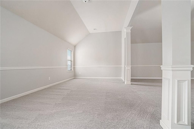 interior space featuring lofted ceiling and light carpet