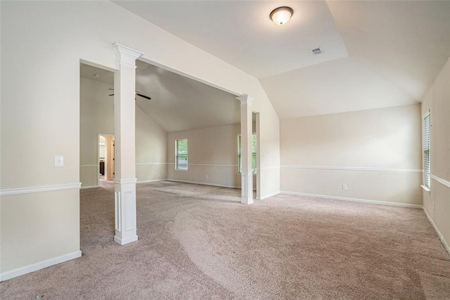 unfurnished room with carpet flooring and lofted ceiling