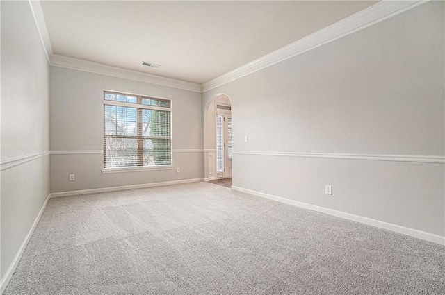 carpeted empty room featuring ornamental molding