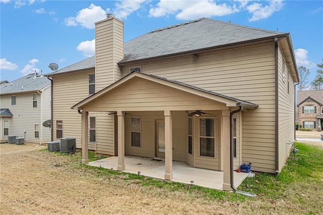 back of house featuring ceiling fan, a patio area, central air condition unit, and a yard