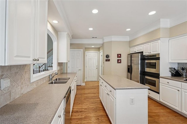 25 Hampreston Ct, Johns Creek, GA 30022 - kitchen with stainless steel appliances, crown molding, a center island, recessed lighting, and white cabinets
