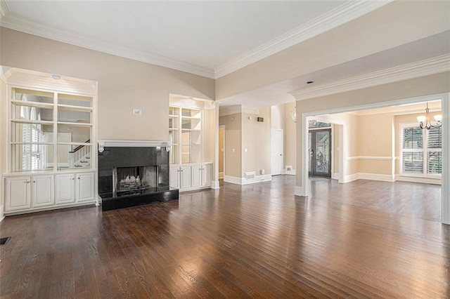 unfurnished living room featuring a chandelier, a fireplace, dark hardwood / wood-style flooring, and ornamental molding