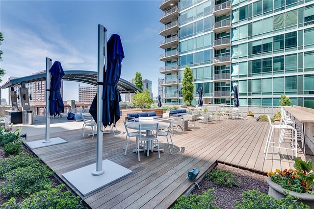 wooden deck featuring outdoor dining space