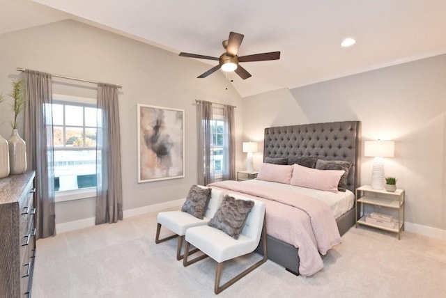 bedroom featuring vaulted ceiling, ceiling fan, and light carpet