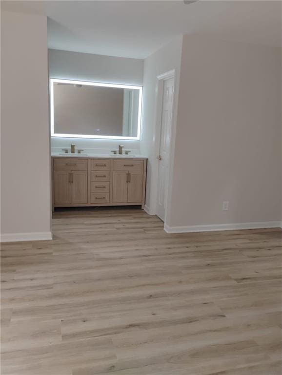 2645 Trotters Walk Trl, Snellville, GA 30078 - bathroom featuring double vanity, baseboards, and wood finished floors