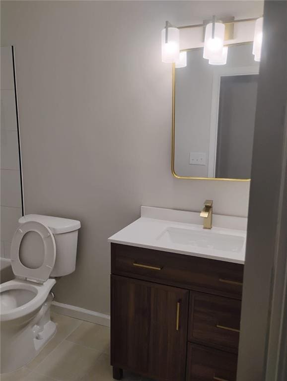 2645 Trotters Walk Trl, Snellville, GA 30078 - bathroom featuring toilet, vanity, baseboards, and tile patterned flooring