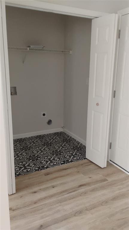 2645 Trotters Walk Trl, Snellville, GA 30078 - laundry room with light wood-type flooring and baseboards