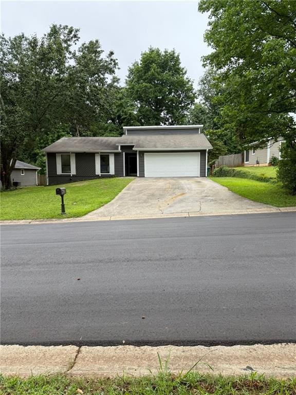 2645 Trotters Walk Trl, Snellville, GA 30078 - view of front of property with a garage, driveway, and a front yard