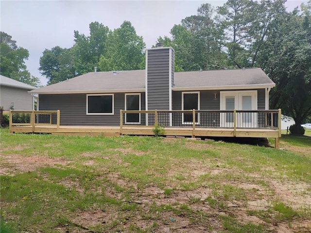 2645 Trotters Walk Trl, Snellville, GA 30078 - back of property featuring a wooden deck and a chimney