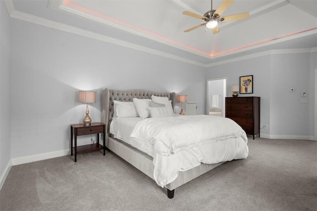 carpeted bedroom with crown molding, ceiling fan, and a raised ceiling