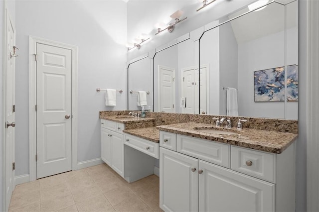 bathroom featuring tile patterned flooring and vanity