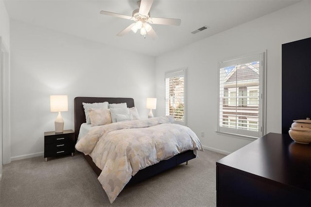 bedroom with ceiling fan and carpet floors