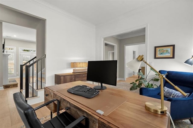 office space with crown molding and light hardwood / wood-style floors