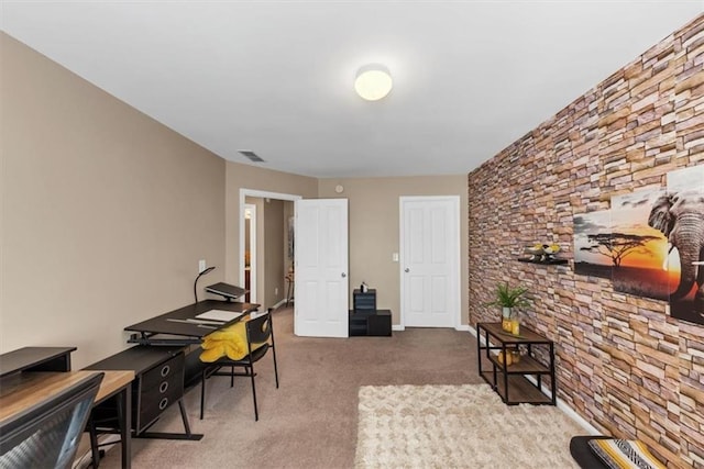 home office with visible vents and carpet flooring