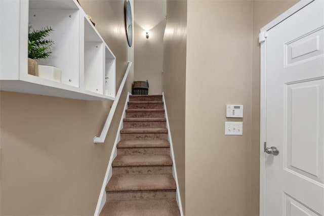 stairway featuring baseboards