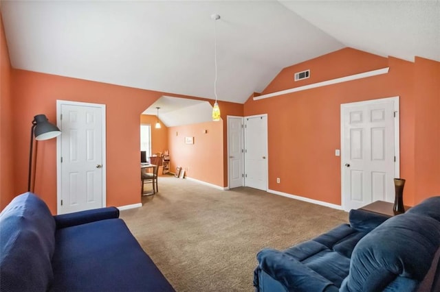 living area with visible vents, baseboards, carpet, and vaulted ceiling