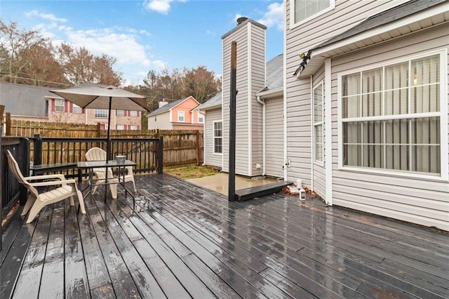 deck with fence and a residential view