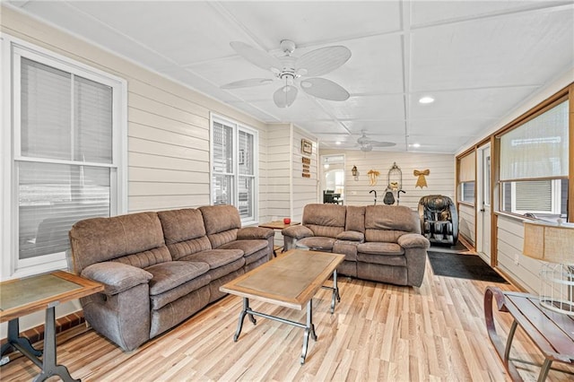 living area with ceiling fan, wood finished floors, wood walls, recessed lighting, and healthy amount of natural light