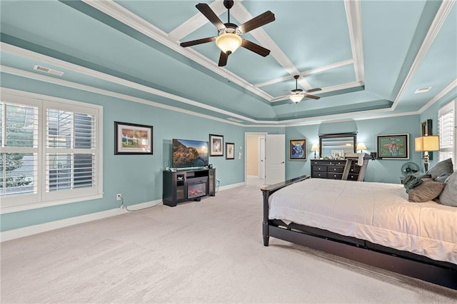 bedroom with a raised ceiling, carpet floors, crown molding, and baseboards