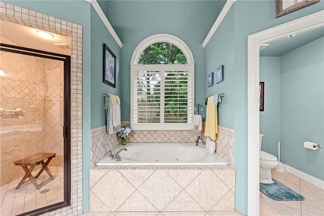bathroom featuring a shower stall, tile patterned floors, a whirlpool tub, and toilet